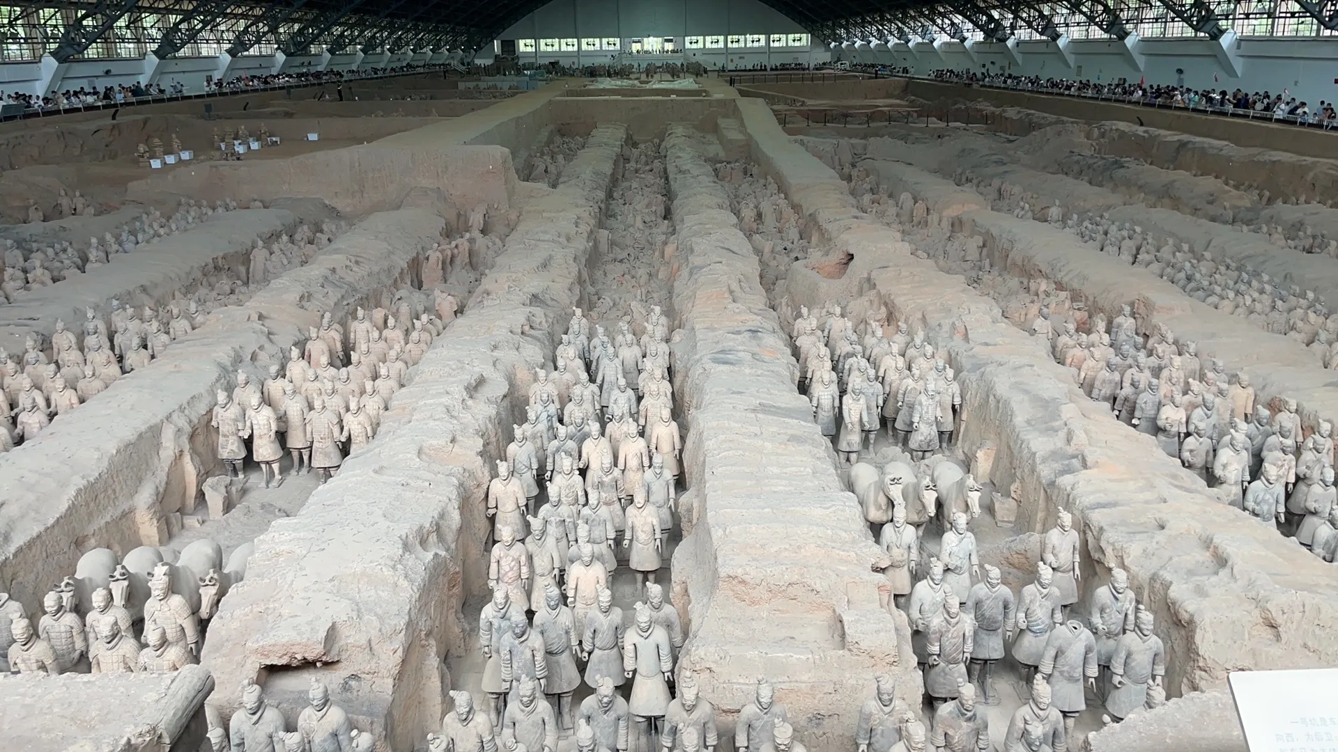 Rows of terracotta warriors inside the covered excavation hall of Pit 1.